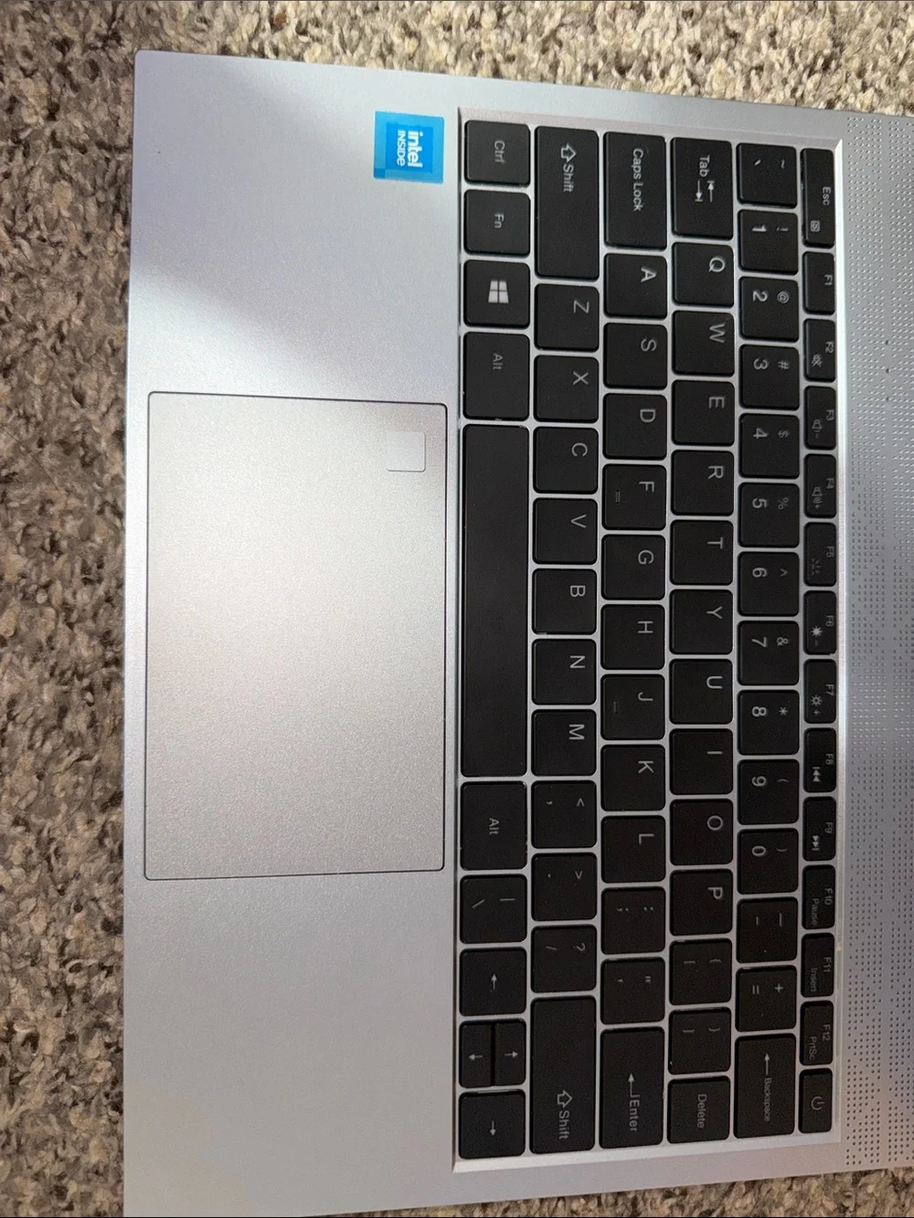 Silver Laptop with Intel Sticker - Sleek Portable Computer